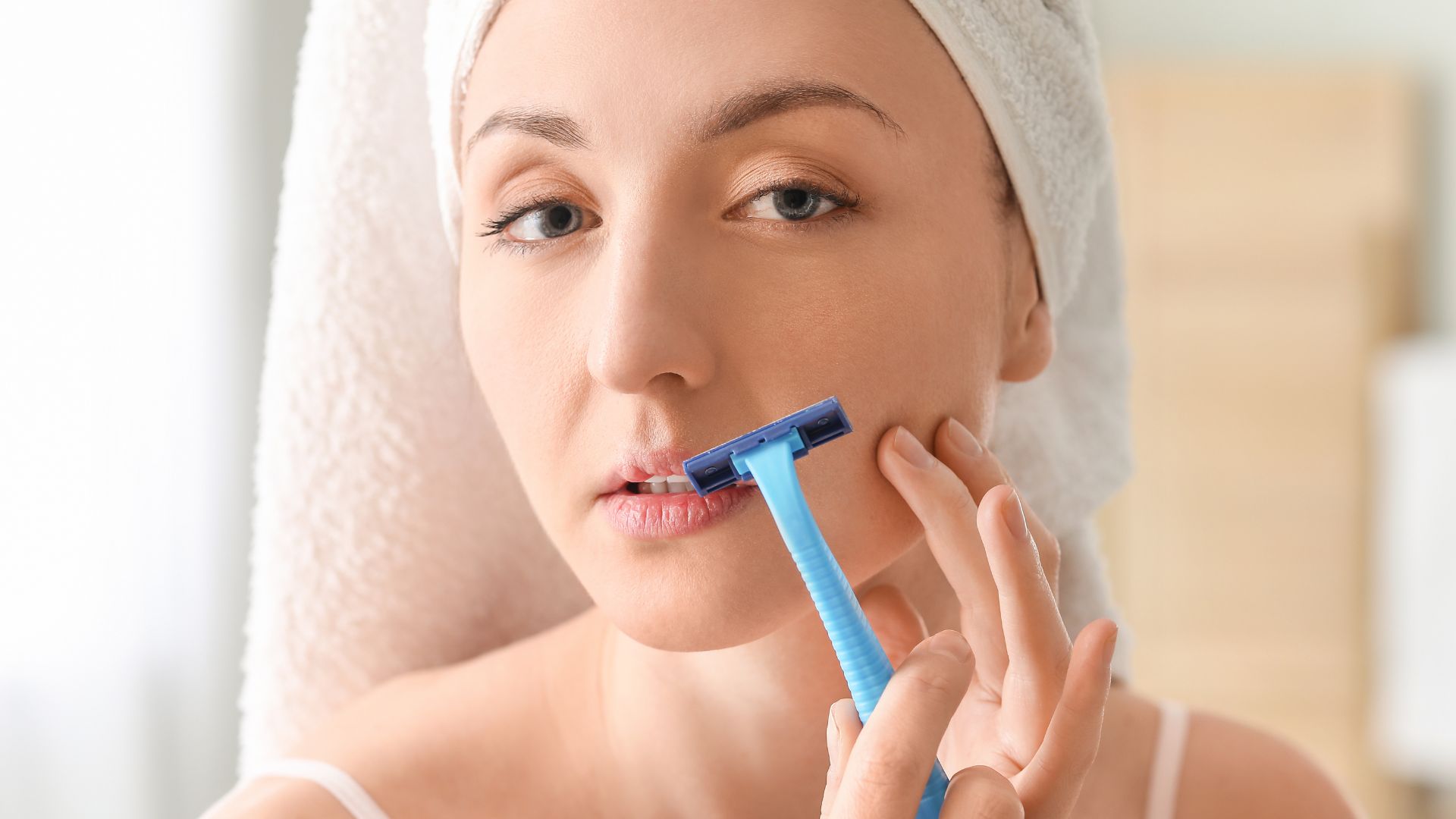 woman shaving hair - featured Image